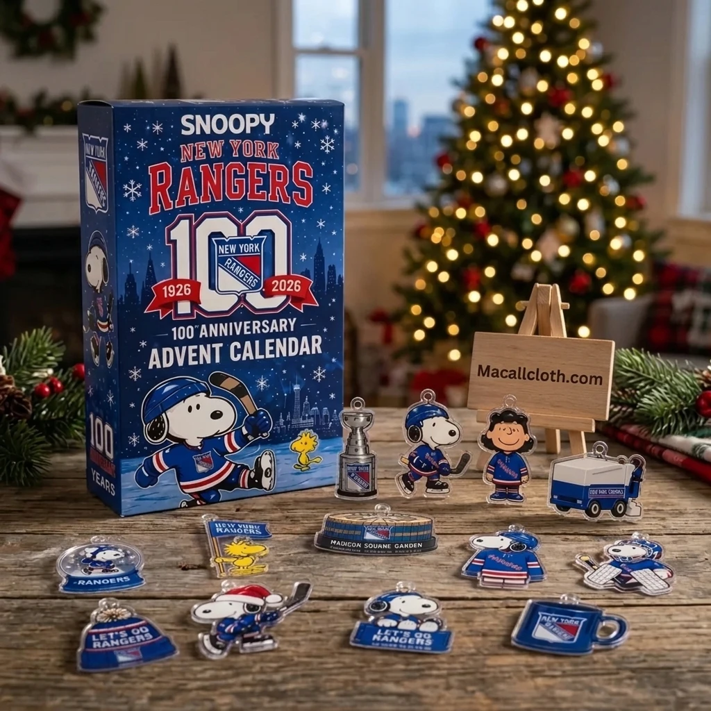Overhead flat-lay of Snoopy New York Rangers 100th Anniversary Advent Calendar box on a rustic wooden table with Peanuts hockey ornaments